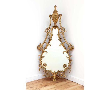 A George III giltwood wall mirror,c.1775, in the manner of William and John Linnell, the shaped plate surmounted by a leaf-ca