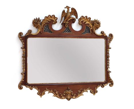A large George II-style mahogany and parcel-gilt mirror, 20th century, the scrolling frame surmounted with a ho-ho bird, flan
