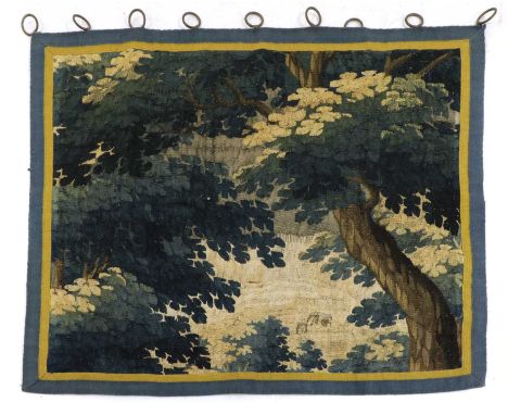 A verdure tapestry fragment,18th century, depicting verdant foliage within a banded border,103 x 94cmCondition report: Faded 