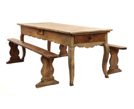 A French provincial sycamore kitchen table,19th century, the plank top with two extra leaves above a shaped apron, with drawe