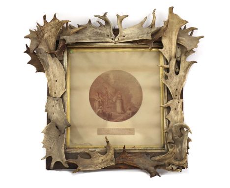 An antler frame, 19th century, the rectangular pine frame decorated by an arrangement of antlers,exterior 102 x 100cmaperture
