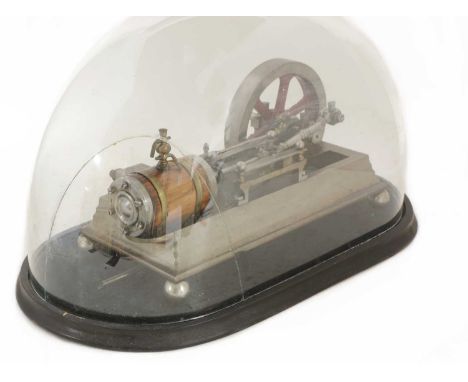 A mill engine apprentice piece,the horizontal engine with a lagged cylinder powering a 5½in (14cm) fly wheel, standing on an 