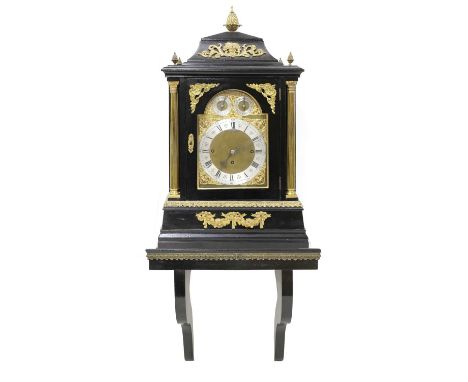 A large ebonised musical bracket clock, early 20th century, the case with gilt-bronze mounts and reeded acanthus columns, the