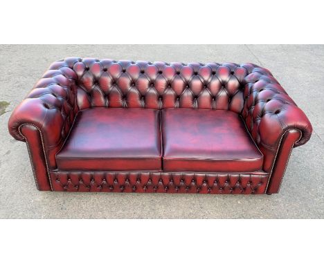 Red leather Chesterfield 2 seater sofa, 74” w x 39”d x 27.5”h