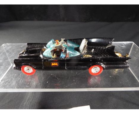 Corgi - A boxed Corgi 267 Batmobile with Red Tyres. The model has a gloss black body, blue tinted windscreen, Batman &amp; Ro