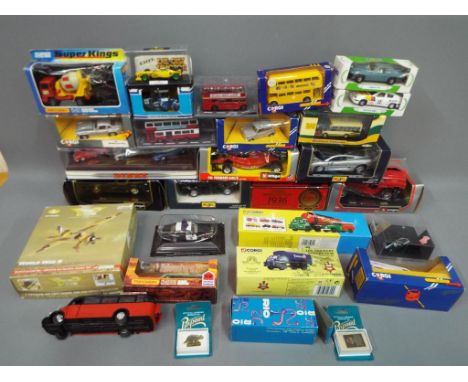 Corgi, Matchbox, Burago and others - in excess of 30 predominately boxed diecast model vehicles in various scales. lot consis