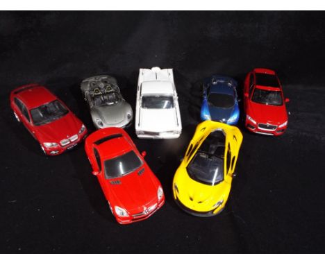 Diecast Vehicles - a collection of seven diecast vehicles predominantly 1:24 scale, unboxed to include Welly, International S