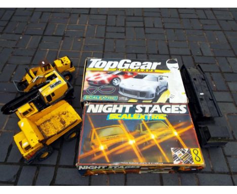 Diecast - Tonka Toys and Scalextric comprising crane, dumper, digger and car transporter, lot also includes night stages (one