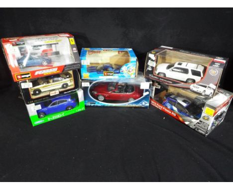 Diecast Vehicles - a collection of seven boxed model cars to include Next models, Maserati Levante 1:24 scale, a Maisto Chevr