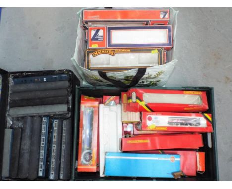 Hornby and others - A suitcase containing in excess of 30 items of OO gauge rolling stock and a large quantity of Model Railw