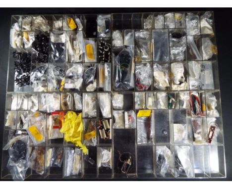 Tri-ang, Airfix &amp; other - Four boxes of OO gauge model railway spare parts, includes pickups, motors, brushes, buffers an