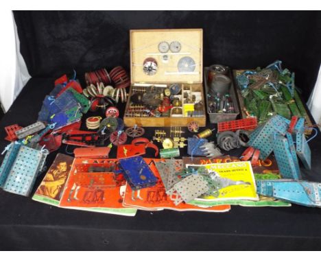 Meccano - A large quantity of Blue, Green, Red and Gold Meccano - some possibly pre-war. The lot also comes with a wooden box