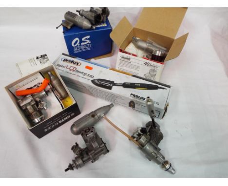 Model Engines - Five model engines predominately boxed and modelling tools. Lot includes Irvine 40 ABC MKIV, an OS LA Series 