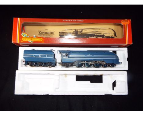 Hornby - A boxed Hornby R685 4-6-2 OO Gauge steam Locomotive and tender 'Coronation' in blue and silver livery. Model appears