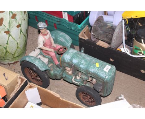 A model of a farmer sitting on a tractor