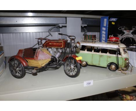 A model of a VW camper van with side awning together with a model motorcycle and sidecar