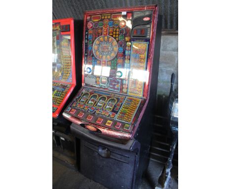 A Red Gaming Lock 'n' Load slot machine (Sold as a collectors item)