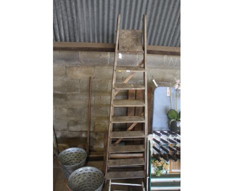 A large wooden folding ladder