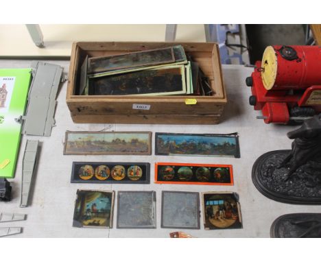 A box of various magic lantern slides
