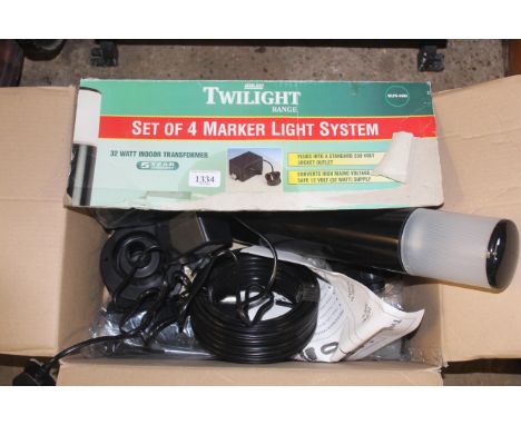A set of four Twilight Marker Light System lights in original box with instruction guide