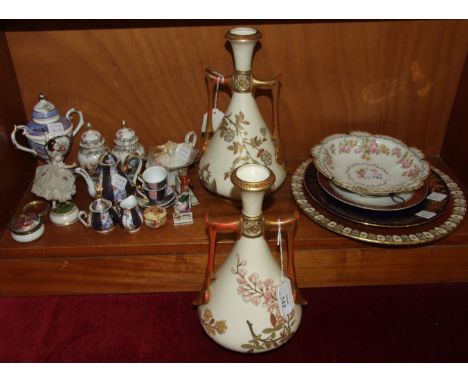 A pair of Royal Worcester two-handled vases decorated with blossom, 26cm high, (both repaired), a Royal Crown Derby plate dec