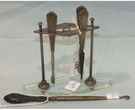 A silver manicure stand of lozenge shape on clear Perspex base, 12cm high, Birmingham 1938, with three manicure items and a s