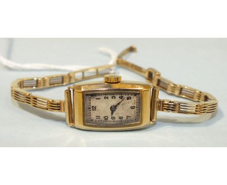 A ladies 9ct-gold-cased wrist watch on 9ct gold gate-link bracelet, total weight, 14g, boxed.