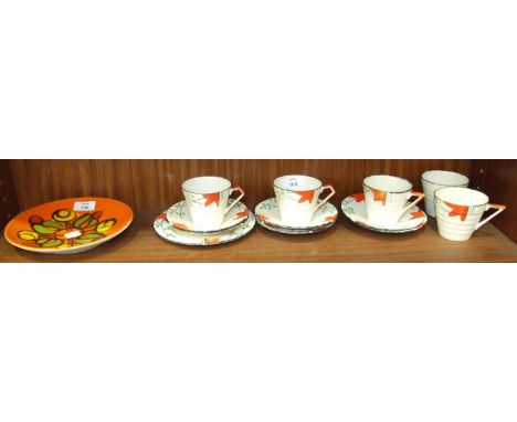 A Poole Pottery plate decorated with stylised flowers on a bright orange ground, 20cm diameter and thirteen pieces of Art-Dec