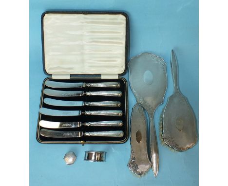 A modern three-piece dressing table set with engine-turned decoration, a cased set of six silver-handled knives and other ite