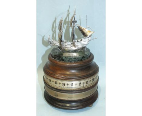 A novelty table clock, late-20th century, surmounted by a silver model of a fully-rigged 'The Golden Hind', the rudder hallma