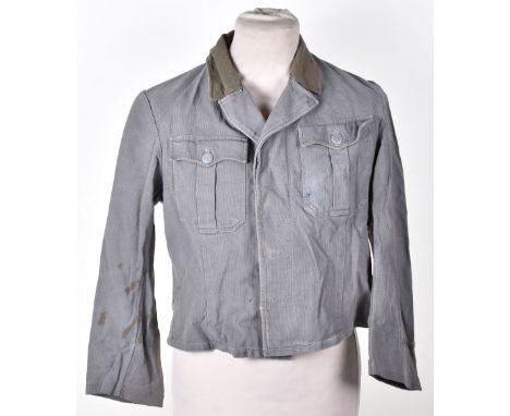 WW2 German Tropical Tunic, which has been cut down and re-used during the post war years when clothing was in short supply. F