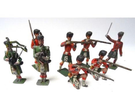 German made 60mm scale Highlanders with Officer and two Pipers (Condition Good-Fair, two rifles loose, one sword replaced,one