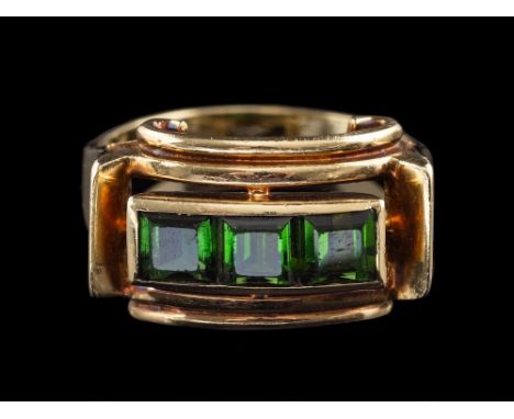 A 1940s green tourmaline ring,: set with three square cut green tourmaline, between scrolled sides, stamped 585, ring size L