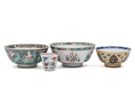 A group of three Chinese famille verte bowls and a teabowl: one with lotus medallion to the interior, the exterior with lotus