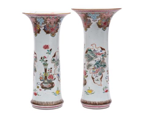 A large graduated pair of Chinese famille rose sleeve vases: finely enamelled with fruit, jardinieres and vases of peonies, l