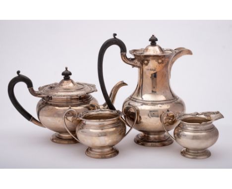 A George V silver four-piece tea service, maker Levesley Brothers, Sheffield, 1914/15: of ovoid form having scroll and flower