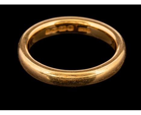 A 22 carat gold ring,: the plain polished band, stamped 22 with full Birmingham hallmarks for 1920, ring size M 1/2, 7g.