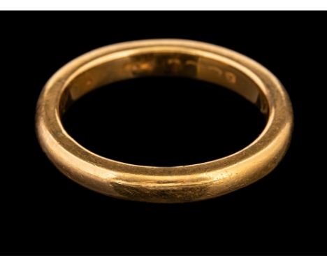 A 22 carat gold ring,: the plain polished band, stamped 22 with full Birmingham hallmarks for 1922, ring size S, 8.7g.