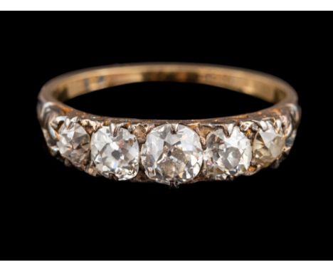 A diamond five stone ring:, set with five graduating old brilliant cut diamonds, in a scrolled setting, stamped 18ct, ring si