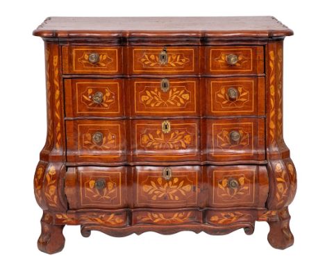 A 19th Century Dutch oak and floral marquetry serpentine block fronted chest of drawers:, bordered with sycamore lines, the t