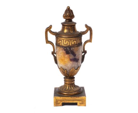 A late 19th century Blue John and ormolu mounted urn: of neo-classical outline, with flaming finial and raised on a square ba