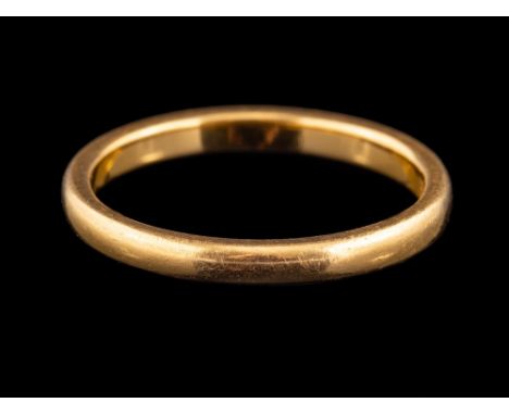 A 22 carat gold ring,: the plain polished band, stamped 22 with full Birmingham hallmarks for 1932, ring size N 1/2, 3.7g.