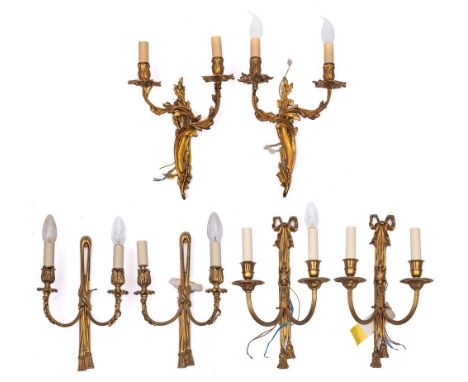 Three pairs of gilt metal twin-light wall appliques, 20th century: one pair in Louis XV style and foliate cast overall, 39cm 