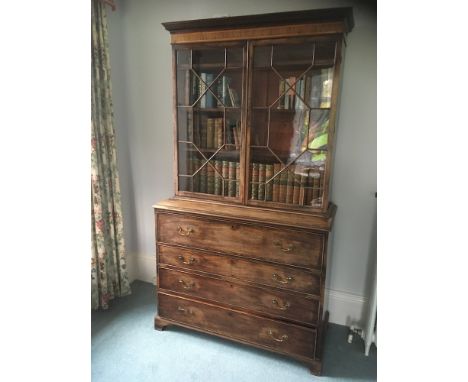 A George III mahogany and inlaid secretaire bookcase:, crossbanded and bordered with boxwood and ebony lines, the upper part 