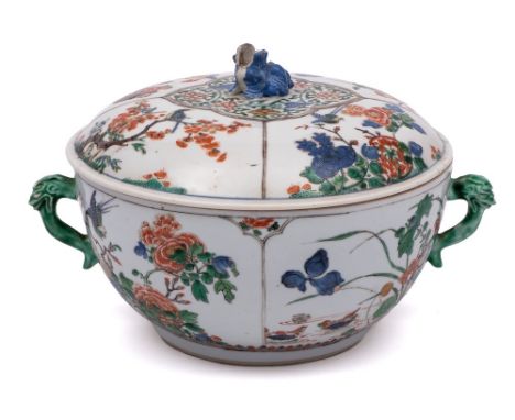 A Chinese famille verte two-handled circular bowl and cover: with lion dog finial and mythical beast mask and tongue handles,