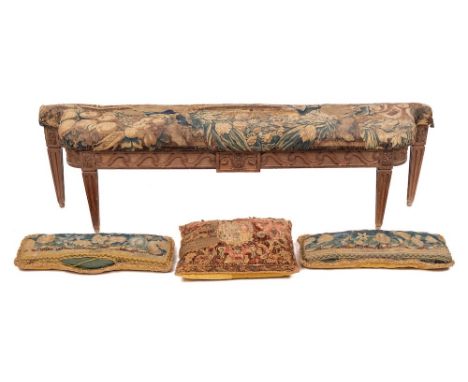 A Louis XVI carved oak and tapestry upholstered window seat, basically circa 1780, the 17th century coverings possibly Mortla
