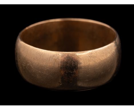 A 9 carat gold ring,: the plain polished band stamped 375 with full Birmingham hallmarks, ring size U 1/2, 8.2g.