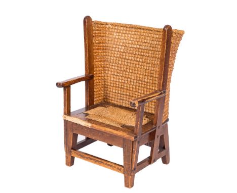 A child's Orkney Islands pine wing armchair:, with a curved ropework back and panel seat having shaped arm supports on square