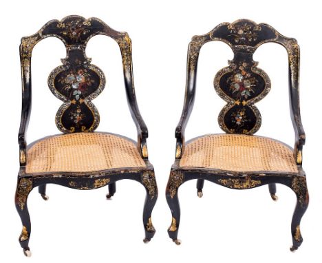 A pair of Victorian black lacquer and decorated occasional chairs:, with floral foliate ornament in gilt, heightened with mot