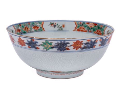 A Chinese verte-imari and incised bowl: the interior painted with a medallion of a jardiniere of flowers within a border of f